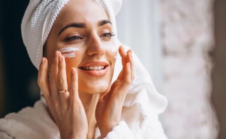 Woman applying face cream